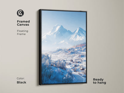 A framed canvas showcases a winter mountain landscape. A black floating frame surrounds the artwork. The print captures snow-covered houses in a valley. The serene mountain backdrop completes this ready-to-hang art.