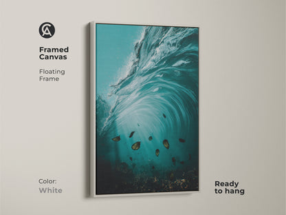 Framed coastal canvas print with a white floating frame. This underwater ocean artwork features teal and aqua hues. The surrealism style wall art print is ready to hang. A tranquil ocean scene.