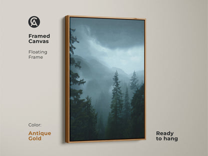 Framed canvas with antique gold finish showcasing a blue misty mountain artwork. The moody forest wall decor features dark green pine trees. Atmospheric nature canvas ideal for forest cabin decor art. This blue green forest print is ready to hang.
