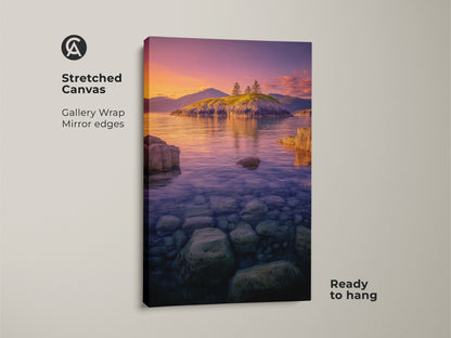 Stretched Canvas Island Seascape Print with gallery wrapped mirror edges. The Coastal Sunset Wall Art displays a rocky shoreline. Ocean landscape photography shows clear water and a vibrant purple orange sky. Ready to hang for instant nature decor.
