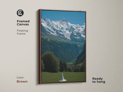 Adorn your walls with this framed canvas art showcasing the Swiss Alps. It features a solitary woman in a lush meadow. A brown floating frame enhances the photorealistic nature scene. This travel-inspired artwork comes ready to hang. Add a touch of Scandinavian charm to any room with this Alpine meadow wall art. A serene mountain scene for wanderlust
