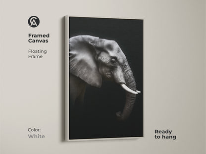 Framed monochrome elephant canvas in a white floating frame. Ready to hang black and white wildlife artwork adds a contemporary touch. Ideal animal portrait canvas for modern office wall art. This elegant animal print is a perfect gift for wildlife enthusiasts.