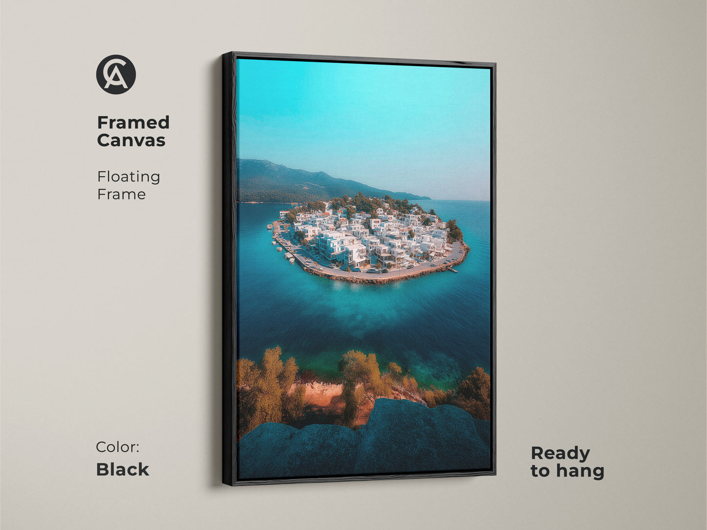 Framed in black this canvas art features an aerial view of a coastal island village. The floating frame enhances the turquoise blue ocean and crisp white architecture. This ready-to-hang artwork brings a modern travel perspective to any space. Ideal for coastal modern home decor a serene gift.