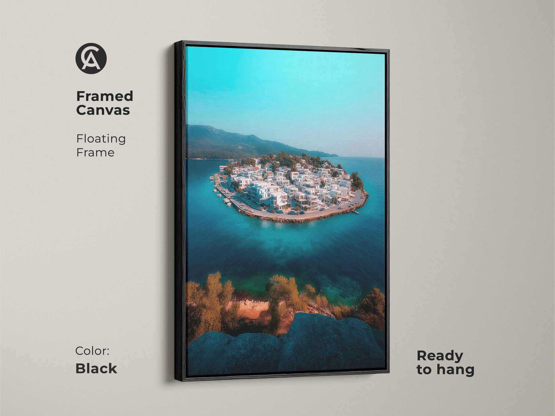Framed in black this canvas art features an aerial view of a coastal island village. The floating frame enhances the turquoise blue ocean and crisp white architecture. This ready-to-hang artwork brings a modern travel perspective to any space. Ideal for coastal modern home decor a serene gift.