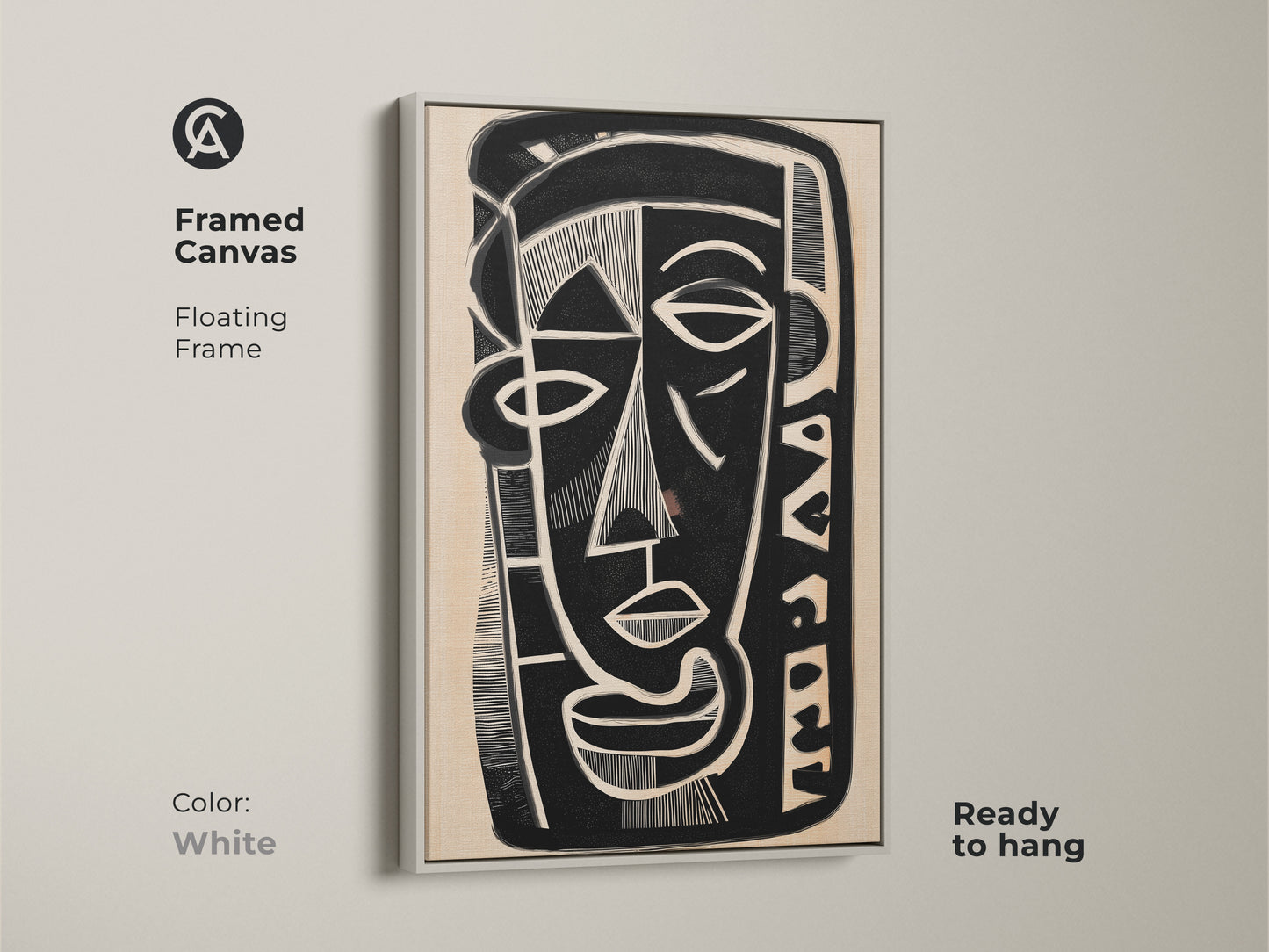 Framed canvas print of a black white and beige abstract face. This floating frame has a white finish and is ready to hang. The modern figurative portrait is an ideal piece for eclectic home decor complementing modern wall art trends.