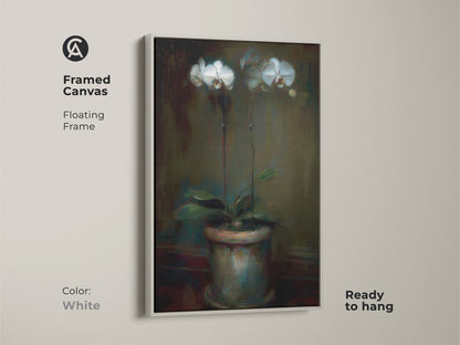 Framed canvas of an emerald green orchid artwork with a white floating frame. Ready to hang contemporary botanical decor. This floral canvas art enhances any space. A sophisticated gift for plant lovers. The potted plant artwork adds elegance.