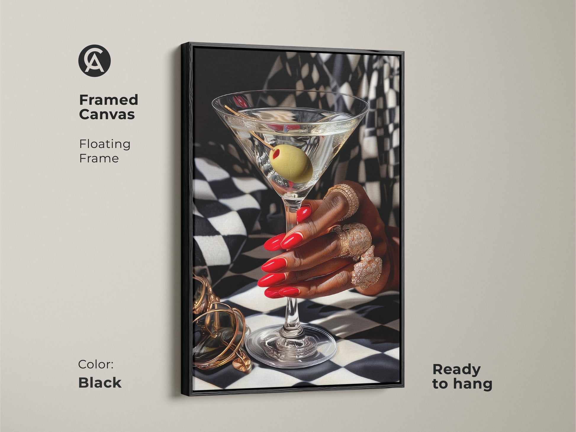 Framed canvas of martini art print with gold jewelry. Art deco artwork featuring red nails and gold rings against a black and white checkered background. Black floating frame adds contemporary style. Glamorous bar decor for a luxury home bar. Perfect gift for cocktail lovers ready to hang.