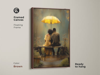Framed canvas with a floating frame featuring a couple under a yellow umbrella. This brown framed romantic rainy day canvas is ready to hang. The bohemian wall art decor makes a great gift for partners. The yellow teal art print creates a cozy atmosphere.