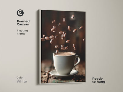 A framed canvas with a white floating frame features a minimalist coffee cup artwork. Falling beans surround a white cup on a wooden table. This contemporary piece enhances modern kitchen decor. It is an ideal housewarming gift or a special treat for coffee enthusiasts.