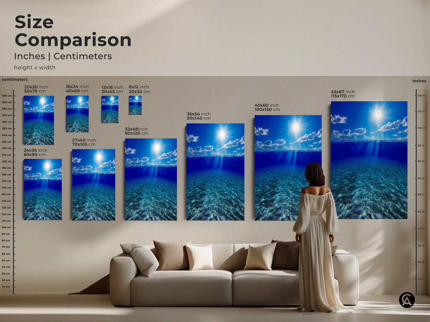 Size comparison of underwater sunbeams in deep blue ocean artwork in inches and centimeters. Various sizes are displayed above a sofa to showcase scale. Choose the ideal size for your space with these canvas and poster prints for a striking coastal art feature.