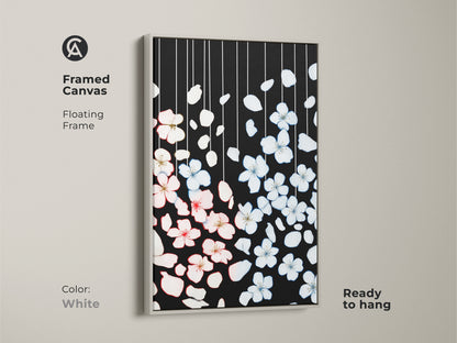Framed canvas print features minimalist cherry blossom art with a clean white frame. The black botanical artwork contrasts with pink and white petals. Ready to hang this frame enhances Scandinavian decor. This art is ideal for adding a touch of nature inspired elegance to any space.