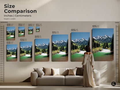 Size comparison of mountain river art prints. See how the canvas artwork looks in different sizes. A person and couch are shown for scale. Perfect for adding a scenic touch to your living room decor.