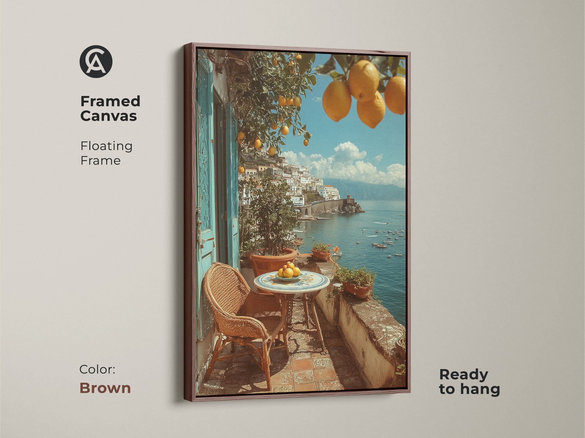Framed canvas print of a Mediterranean lemon artwork. The floating frame is brown and the art is ready to hang. The coastal villa art shows a balcony with lemons and a coastal town in the background. Ideal housewarming gift for travel lovers. This yellow orange blue landscape art adds summer vacation vibes to your home.