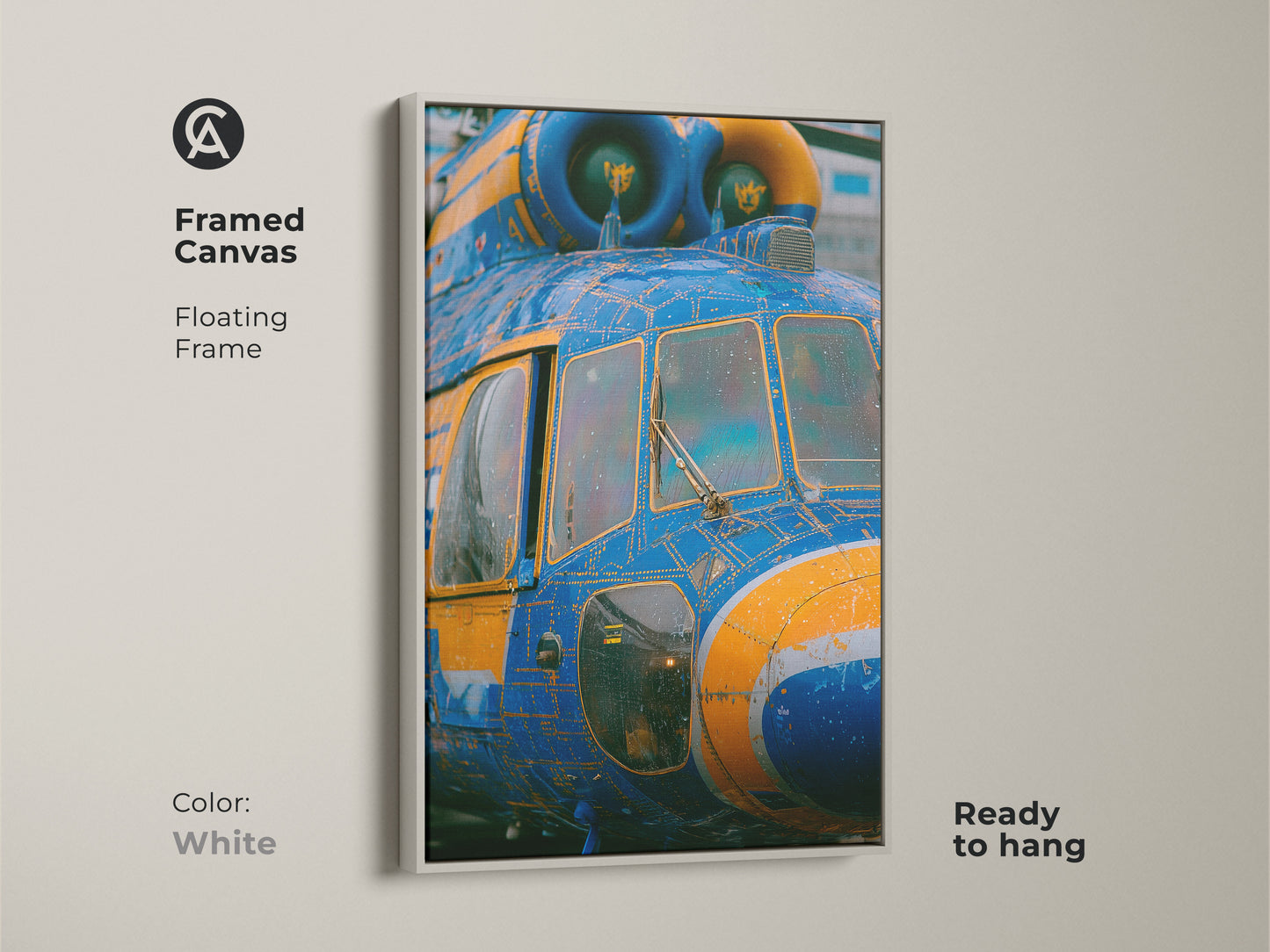Framed canvas art featuring a blue and yellow helicopter. The floating frame is white. This unique piece of art is ready to hang. The helicopter artwork is printed on a framed canvas.
