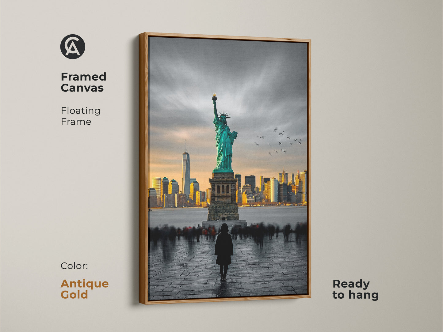 This framed canvas art shows the Statue of Liberty and the New York City skyline. The frame is an antique gold color and comes ready to hang. The image shows a person viewing the statue. This floating frame canvas will add a touch of elegance to your space.