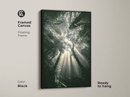 Framed canvas featuring an emerald forest wall decor. Black floating frame enhances the lush jungle wall hanging. Ready to hang and enjoy. This photorealistic forest scene is perfect for boho decor.