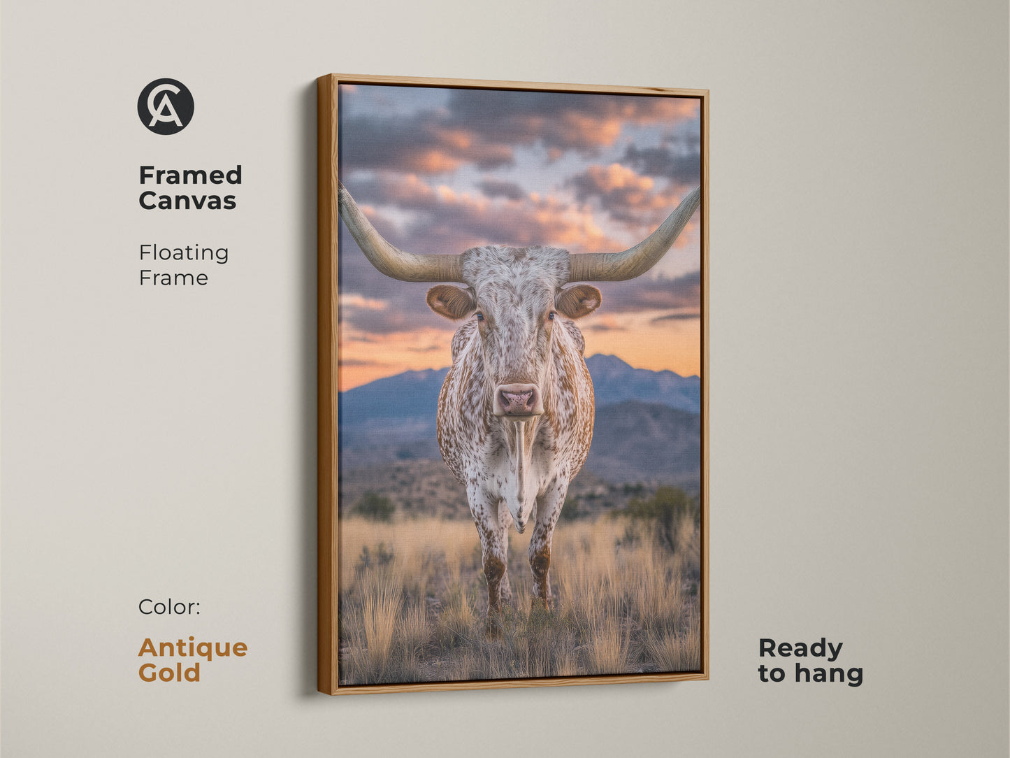 Framed canvas of a longhorn steer with an antique gold floating frame. This rustic western artwork showcases a mountain sunset. This farmhouse landscape art is ready to hang. It's a nice cowboy gift.