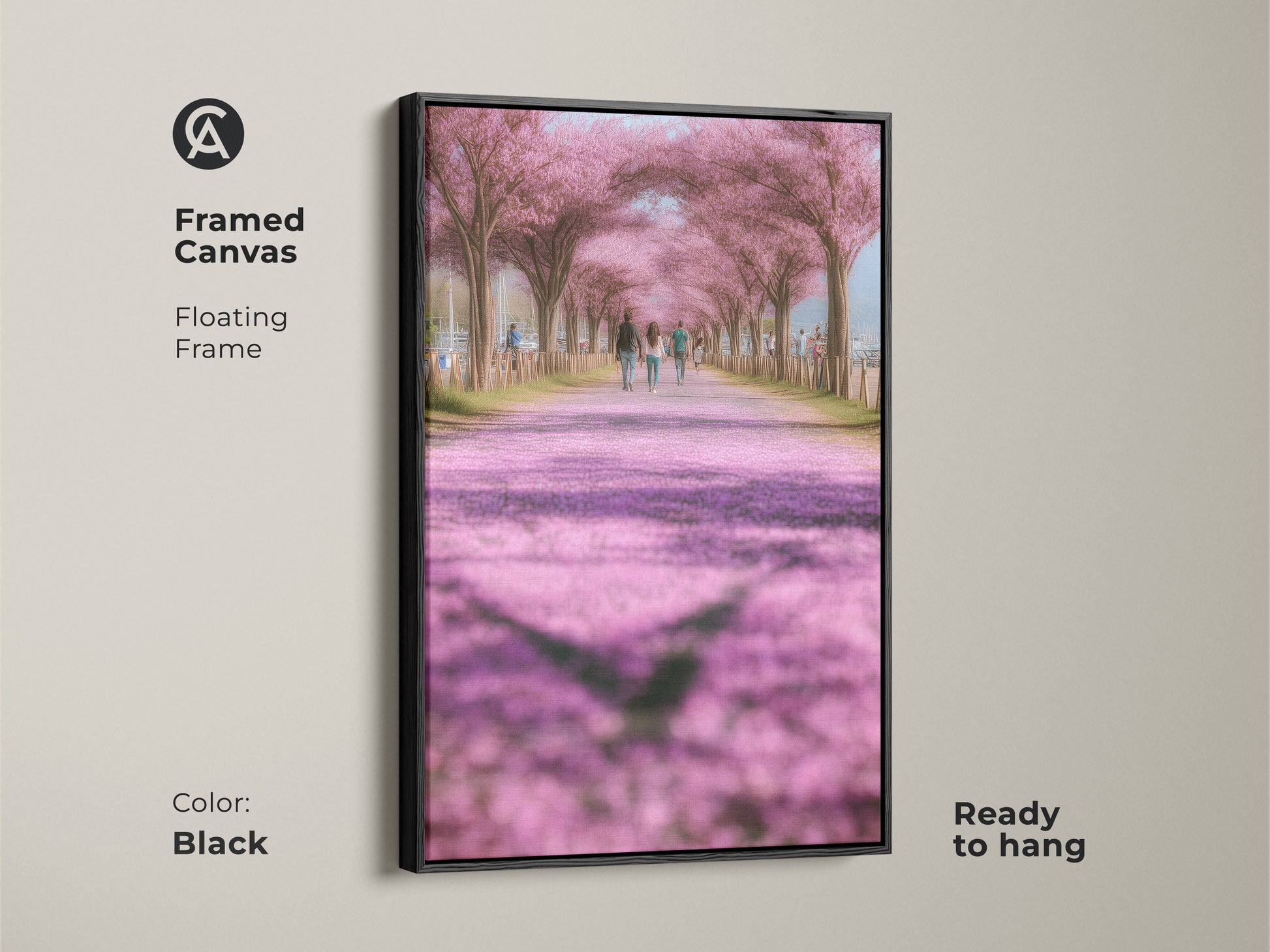 Framed canvas art showing a romantic cherry blossom path. The floating frame is black and ready to hang. This impressionistic landscape brings a touch of spring to your home. Soft pink wall decor for a bedroom or living room. A thoughtful gift for nature lovers.