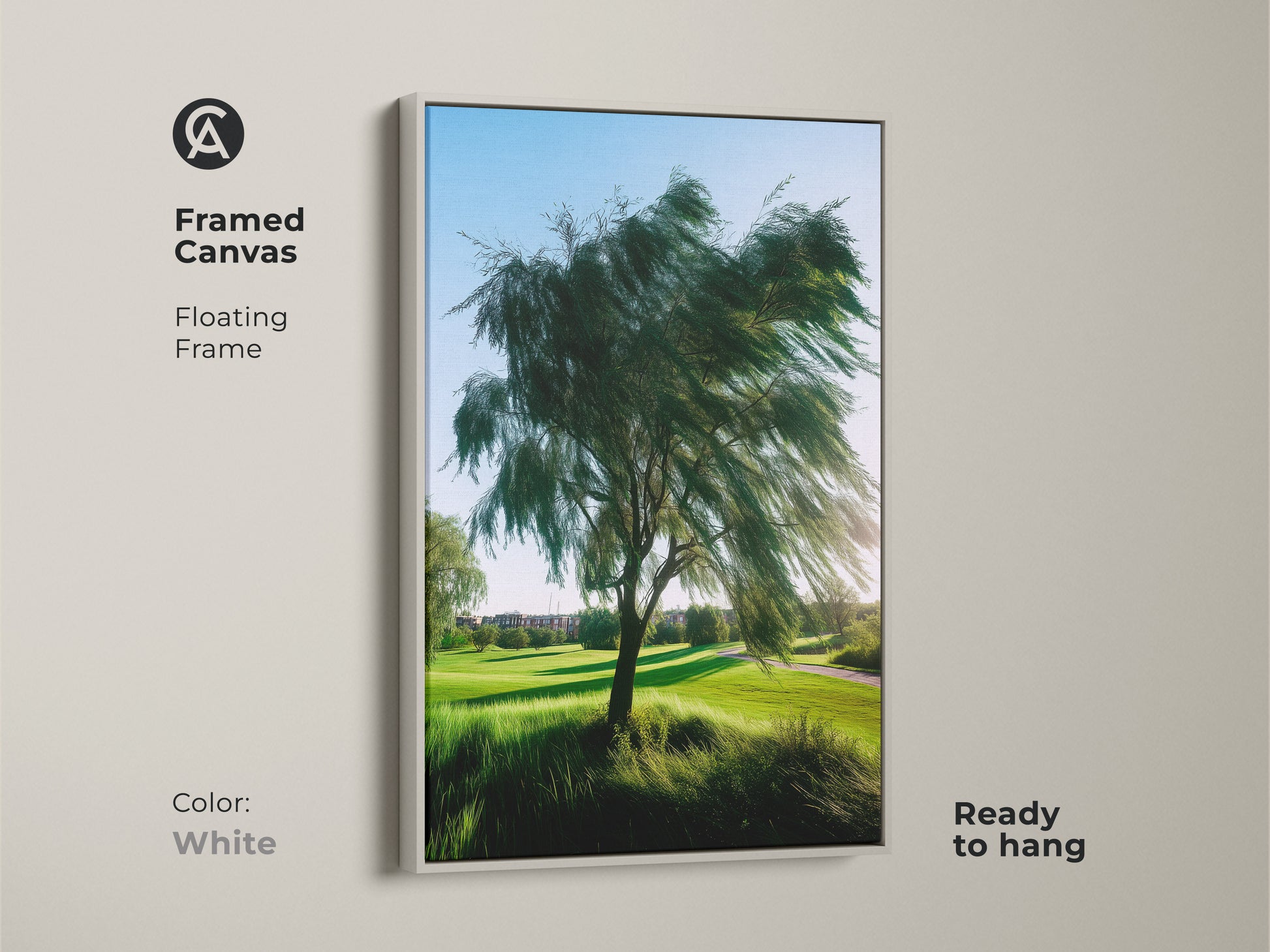 White framed canvas art of a golf course landscape. The floating frame showcases realistic nature photography of a windswept tree. Ready to hang for a contemporary bedroom decor.