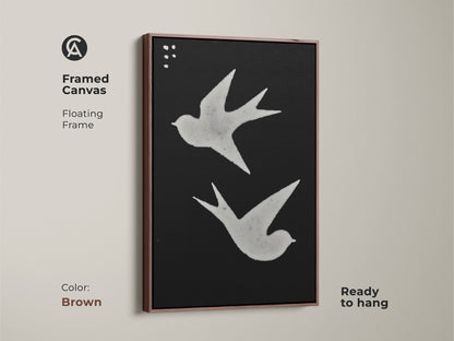 Framed canvas with minimalist bird illustration. The black and white print features a floating frame. Ready to hang Scandinavian decor for any room. Abstract nature canvas adds a touch of modern folk art. Great animal art for walls.