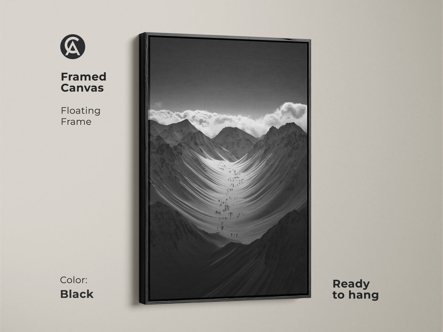 Framed black and white mountain art print with a floating frame. This monochrome canvas art is ready to hang. The hikers are ascending a vast snowy mountain range. This nature scenery wall art adds adventure to any space.