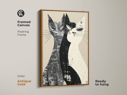 Framed canvas of a Mid-Century Modern cat art with a floating frame in antique gold. This graphic cat artwork features two cats in a black and white linocut style. It's a ready-to-hang stylish home art for living rooms or bedrooms.