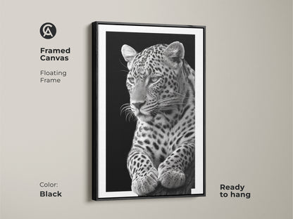 Black framed canvas featuring a monochrome leopard. The floating frame enhances the photorealistic wildlife art. Elevate your space with this animal lover gift. Shop now for modern animal artwork!