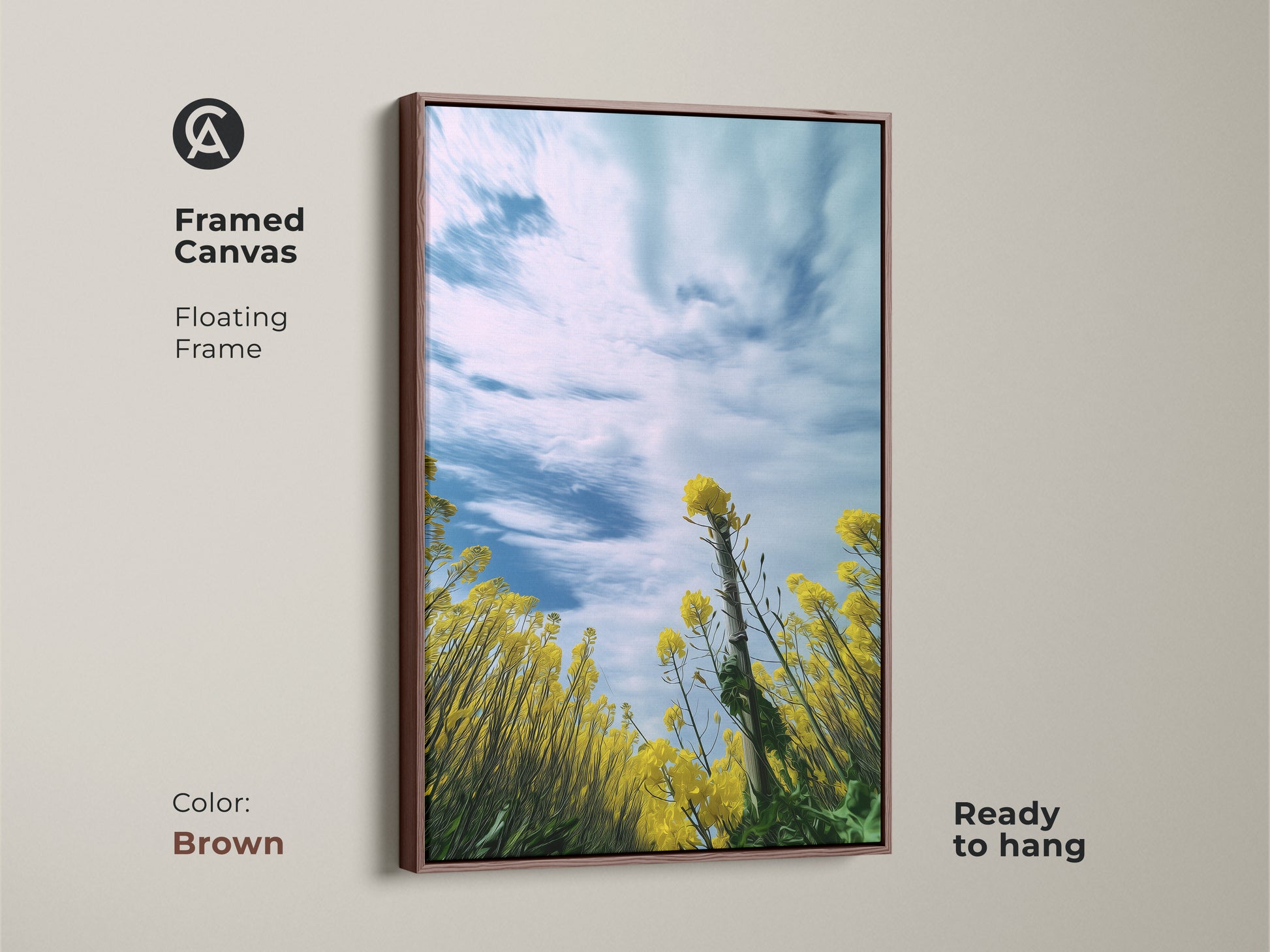 Framed canvas print showcasing a yellow canola field. The floating frame in brown finish complements the impressionistic artwork. Features blooming yellow flowers set against a blue sky. This spring landscape wall art is ready to hang. Ideal for adding a touch of nature to your home or as a thoughtful gift for garden lovers.