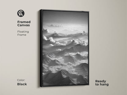 Black framed canvas displays monochrome mountain wall art. Aerial landscape print offers a modern nature decor. Black and white mountain artwork enhances any space. Ready to hang floating frame complements minimalist landscape decor. Perfect for high altitude art lovers.