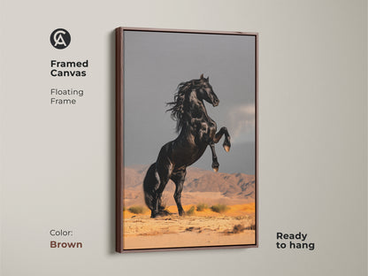 Framed canvas of a rearing black horse in a desert setting. Features a floating frame in brown. This modern animal art adds a touch of untamed elegance. Ideal for equestrian themed decor or as a gift for nature art lovers. Its ready to hang.