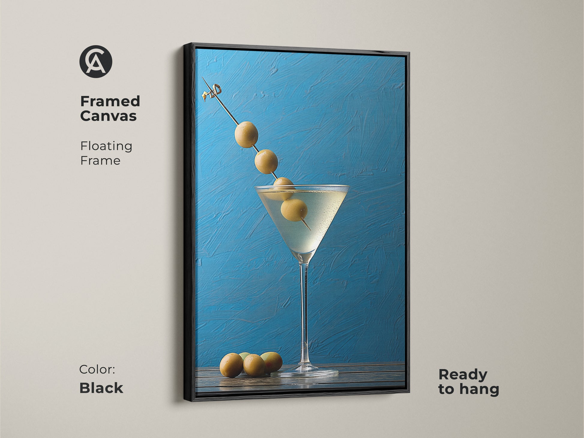Framed canvas with a black floating frame showing a martini artwork. This still life artwork is ready to hang. Perfect for modern bar artwork or blue kitchen decor. It is a contemporary gift featuring an olive garnish. The azure blue background enhances home bar decoration.