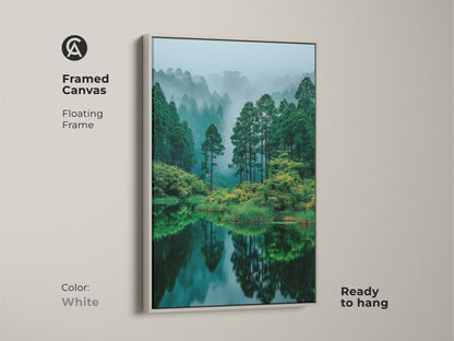 White framed canvas art highlighting a serene forest lake. The floating frame offers a clean modern look. Ready to hang this piece brings a fresh and calming natural element to your interior.