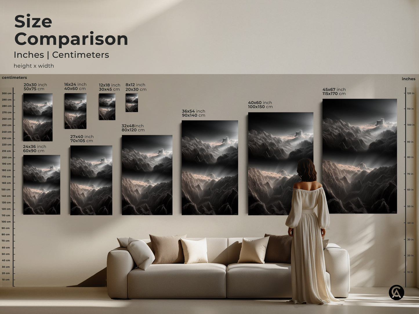 Size comparison of minimalist mountain artwork in inches and centimeters. See the abstract landscape canvas in various sizes above a modern sofa. Dark gray and white wall art for a serene living room.