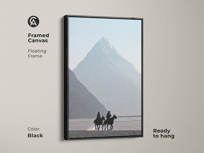 Framed canvas showcases a minimalist cowboy art. Black floating frame adds elegance. Misty blue mountain backdrop evokes a peaceful scene. Ready to hang equestrian wall decor for a modern touch. Ideal for man cave or rustic home decor.