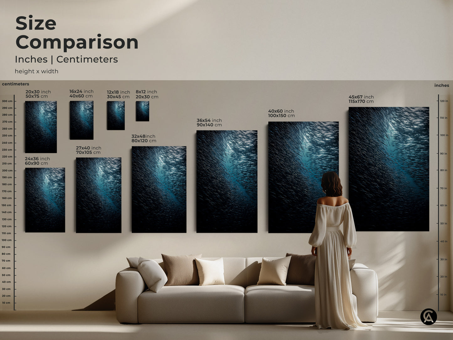 Size comparison of deep sea wildlife art in inches and centimeters. A woman views various sizes of the teal blue ocean canvas above a sofa. This school of fish artwork is perfect for coastal living room wall art. Find your ideal fit.