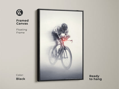 Framed canvas of a cyclist in motion. This floating frame is in black. The monochrome action art is ready to hang. This sports speed wall art is dynamic. A perfect piece for office workplace art. Its a great gift for a cyclist.