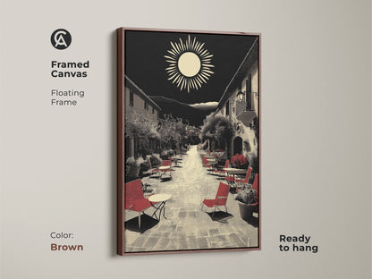 This framed canvas displays Mediterranean village street artwork in a brown floating frame. This ready-to-hang piece is a housewarming art gift featuring red seating in a retro sun landscape. The black and beige wall decor suits a European cafe scene. Ideal for travel enthusiasts seeking wanderlust wall decor.