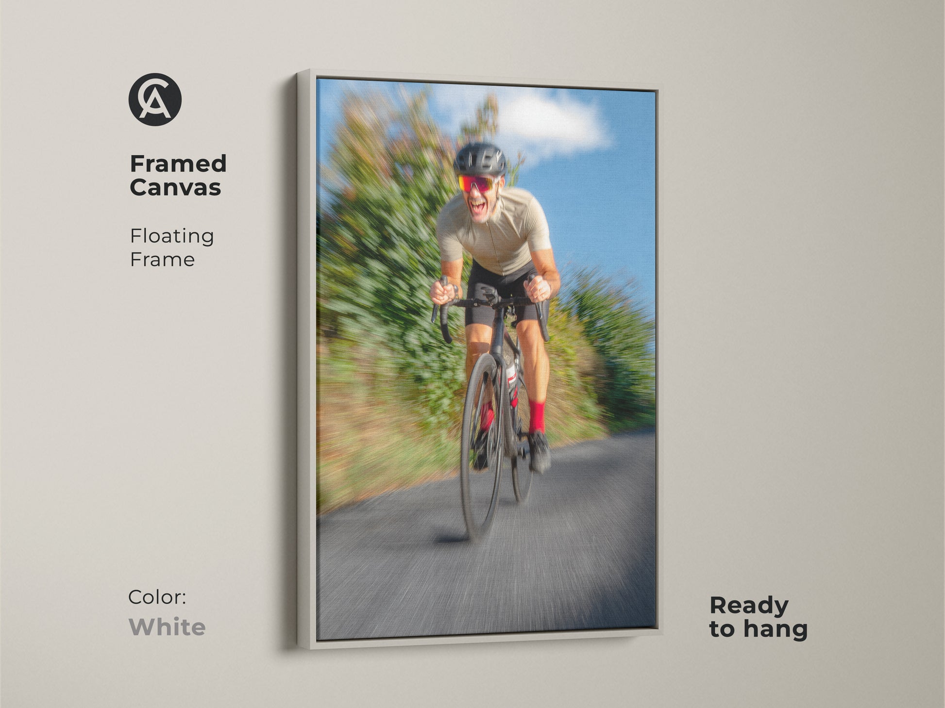 Framed cyclist artwork with a white floating frame. This motion blur art adds a dynamic touch. It's a contemporary piece perfect for modern sports wall decor. The blue and grey tones create a calming yet energetic feel. A great gift for cyclists.