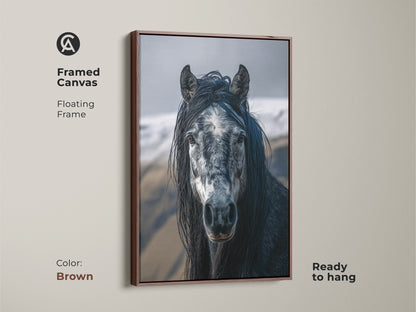 Framed canvas featuring a photorealistic horse in a brown floating frame. This dark grey and white animal portrait is ready to hang. It's a rustic equine art piece for horse lovers.  Perfect for adding a touch of natural elegance to any room. This canvas enhances your home decor.