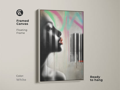 Framed canvas print of a contemporary woman's portrait with a white floating frame. The urban graffiti style artwork blends black and white tones with pink accents. Ready to hang it offers an edgy modern touch to your home decor. A unique fine art piece.