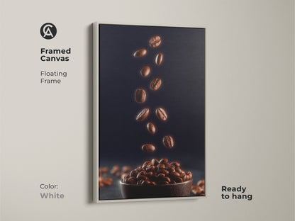 Framed canvas with a floating white frame showcasing falling coffee beans. This contemporary coffee decor has rich brown coffee beans against a deep navy background. Ready to hang artwork that adds a modern touch to any kitchen or home bar.