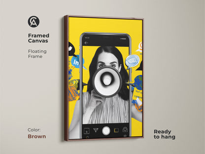 Framed canvas art with a brown floating frame displaying a social media megaphone collage. The artwork comes ready to hang. Its contemporary art style is ideal for office decor. A thoughtful gift for marketing professionals. The brown frame complements the vibrant yellow hues.