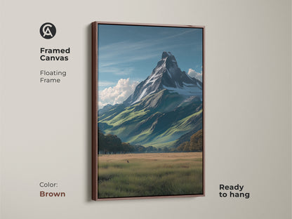 Framed canvas artwork with a floating frame in brown color. This scenic mountain vista art captures a realistic snowy peak above green meadows. Perfect as traditional home decor or a thoughtful housewarming gift for hikers ready to hang.
