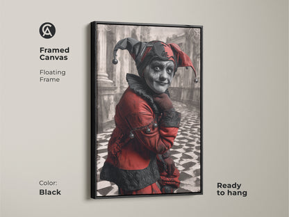 Framed canvas of a crimson and black gothic jester portrait. Floating frame in black. Ready to hang. The harlequin character art brings a unique touch to eclectic home decor or any space for that matter