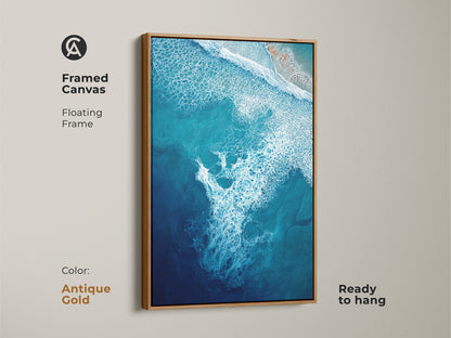 Framed canvas with an antique gold floating frame showcases deep blue ocean artwork. This turquoise aerial view art enhances coastal decor. Ready to hang this abstract print suits beach lovers. Modern abstract seafoam art for your space. This is a beautiful abstract seascape painting.