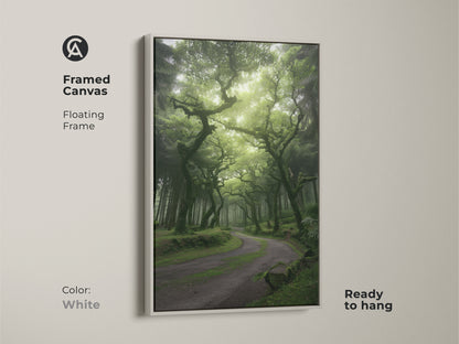 Framed canvas print displays a misty forest with emerald green trees and an enchanted woodland path. The white floating frame complements the nature landscape canvas. It is ready to hang as boho woodland wall art. This artwork brings serene beauty to any room