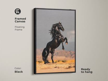 Framed canvas of a black stallion rearing in a desert. Floating frame in black color adds a modern touch. Ready to hang and embodies power. A standout piece for home decor or a thoughtful gift for equestrian theme enthusiasts.