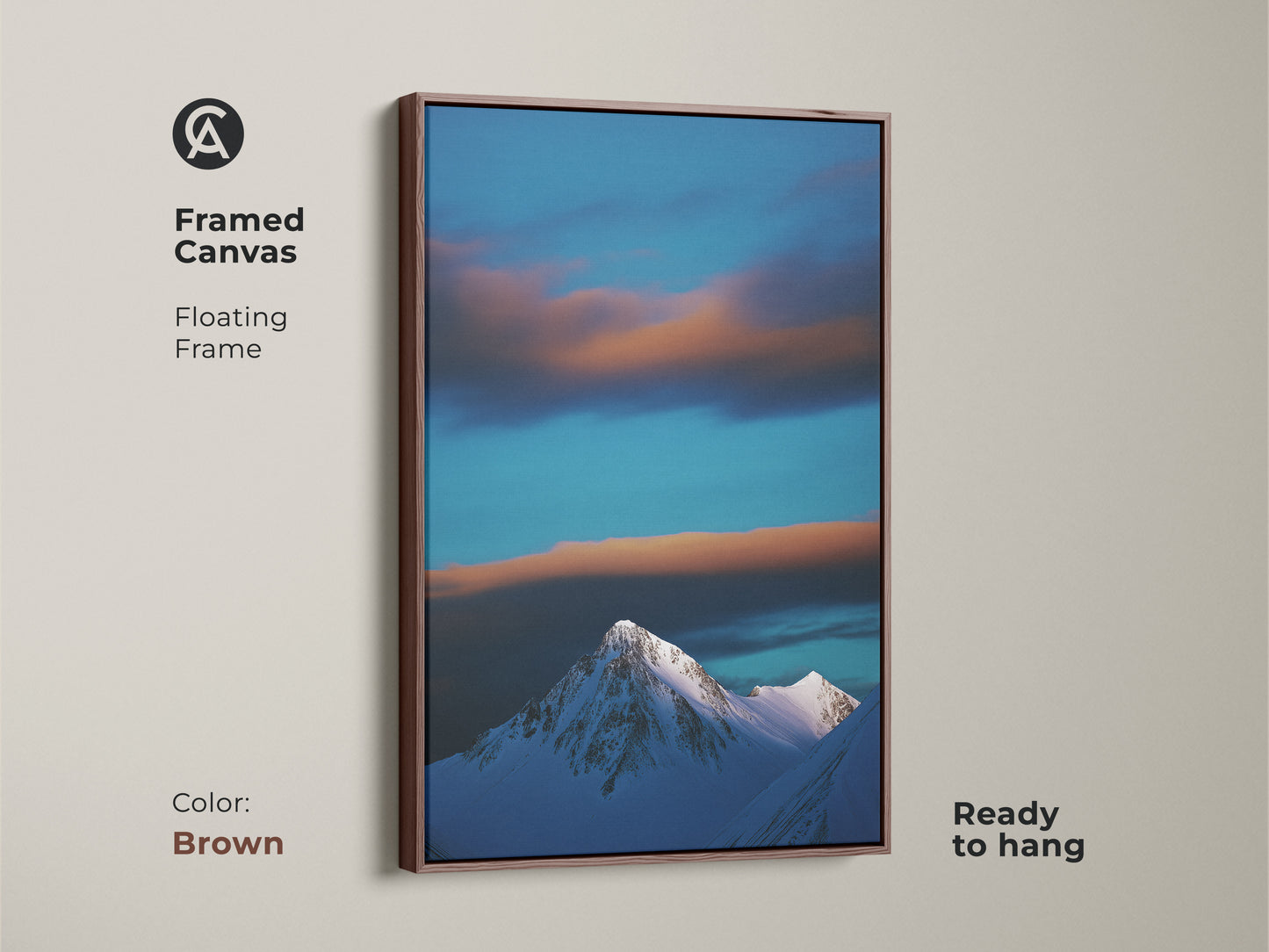 This framed canvas in brown showcases a stunning snowy mountain landscape. The blue sky and clouds enhance the contemporary nature artwork. Ready to hang it brings a tranquil winter scene to your home. A perfect housewarming gift.