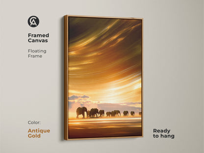 Framed canvas art features elephants on a savanna at sunset with an antique gold floating frame. The boho wildlife landscape art has orange yellow gold colors. The nature inspired canvas print is ready to hang.