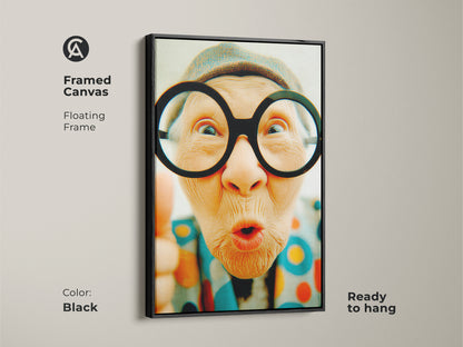 Framed canvas artwork of a funny senior lady with glasses. The artwork features a sleek black floating frame. This unique piece is ready to hang bringing a modern touch to your art collection.